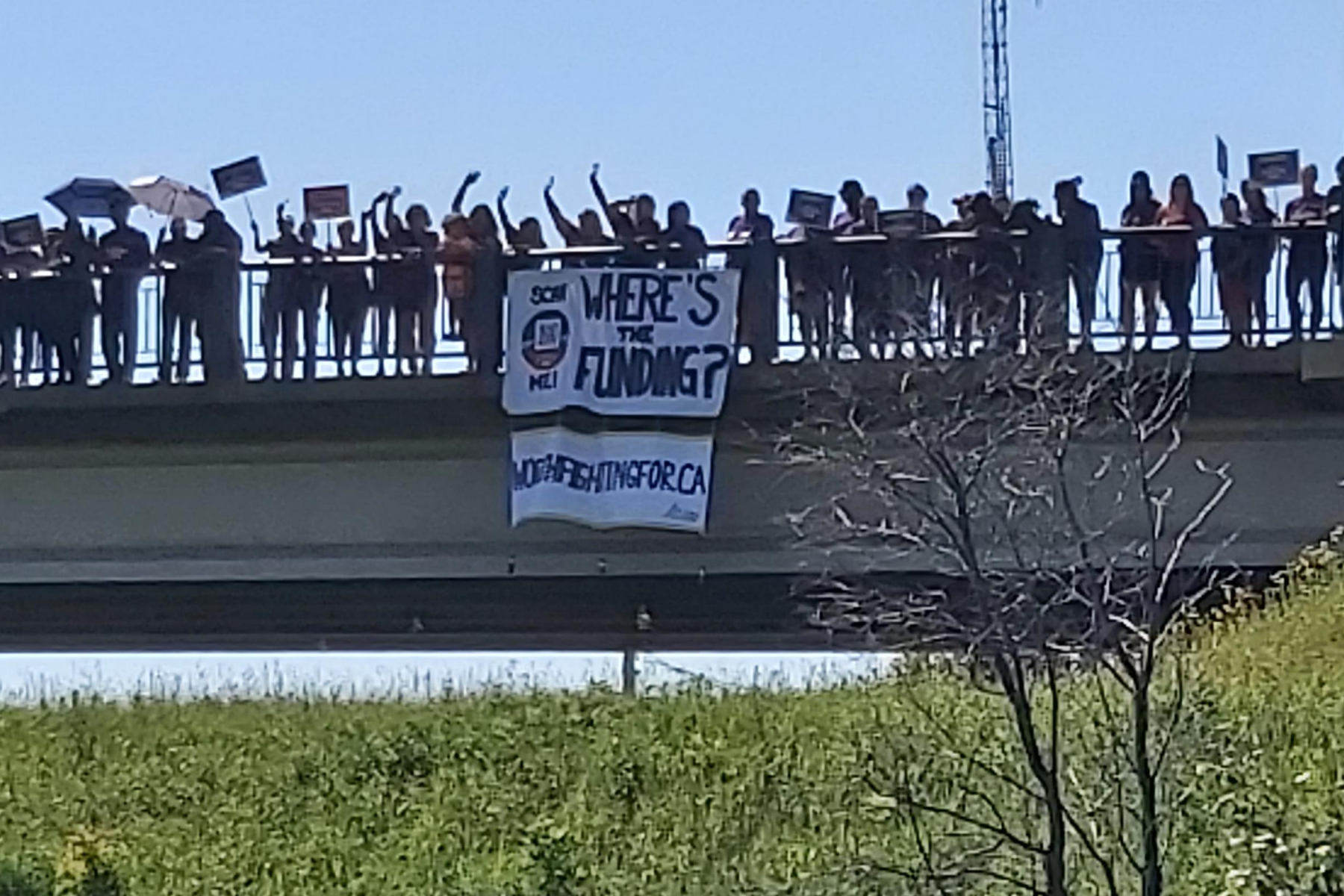 We won’t be ignored: striking community, health and social services workers drop banners from bridges and highway overpasses across Ontario 