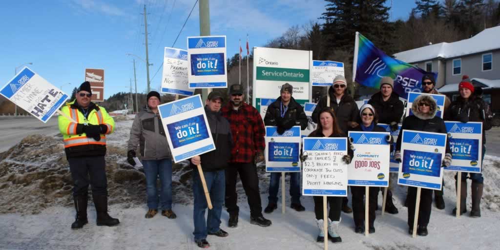 OPSEU members holding signs and flags in Minden