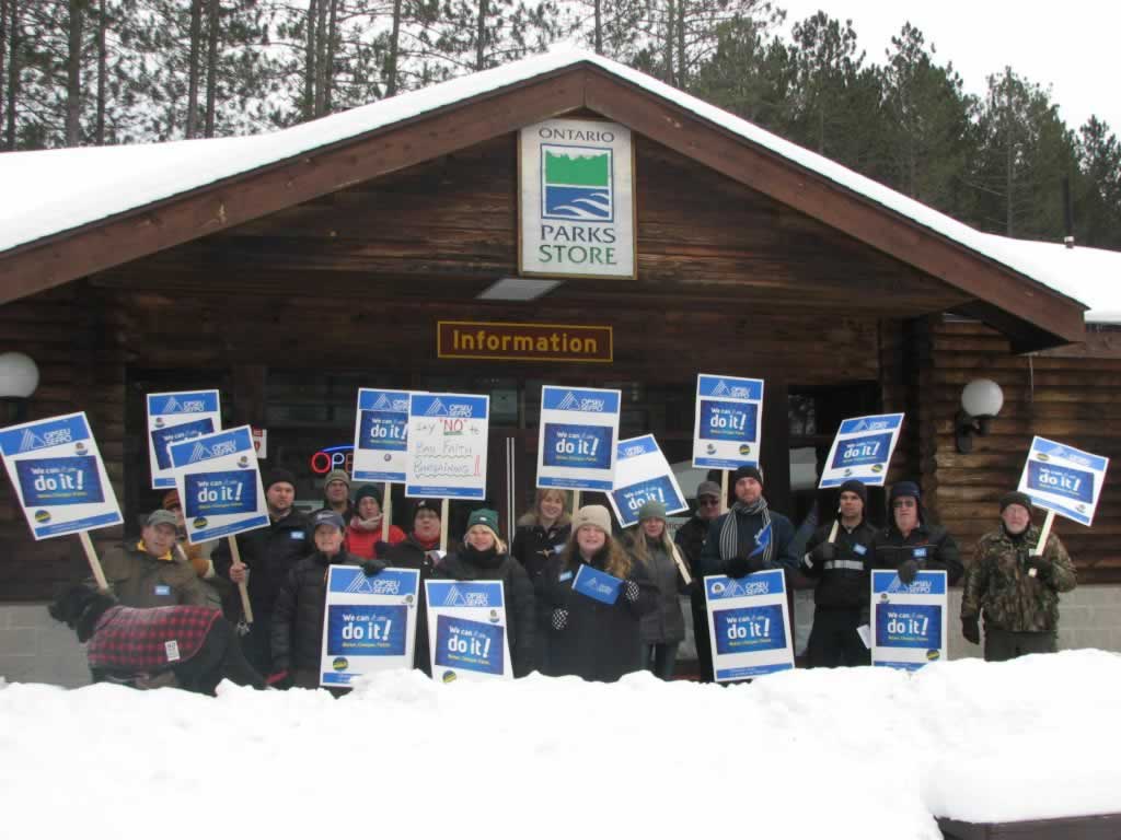 OPSEU members holding signs outside an Ontario Parks Store in Chatham-Kent