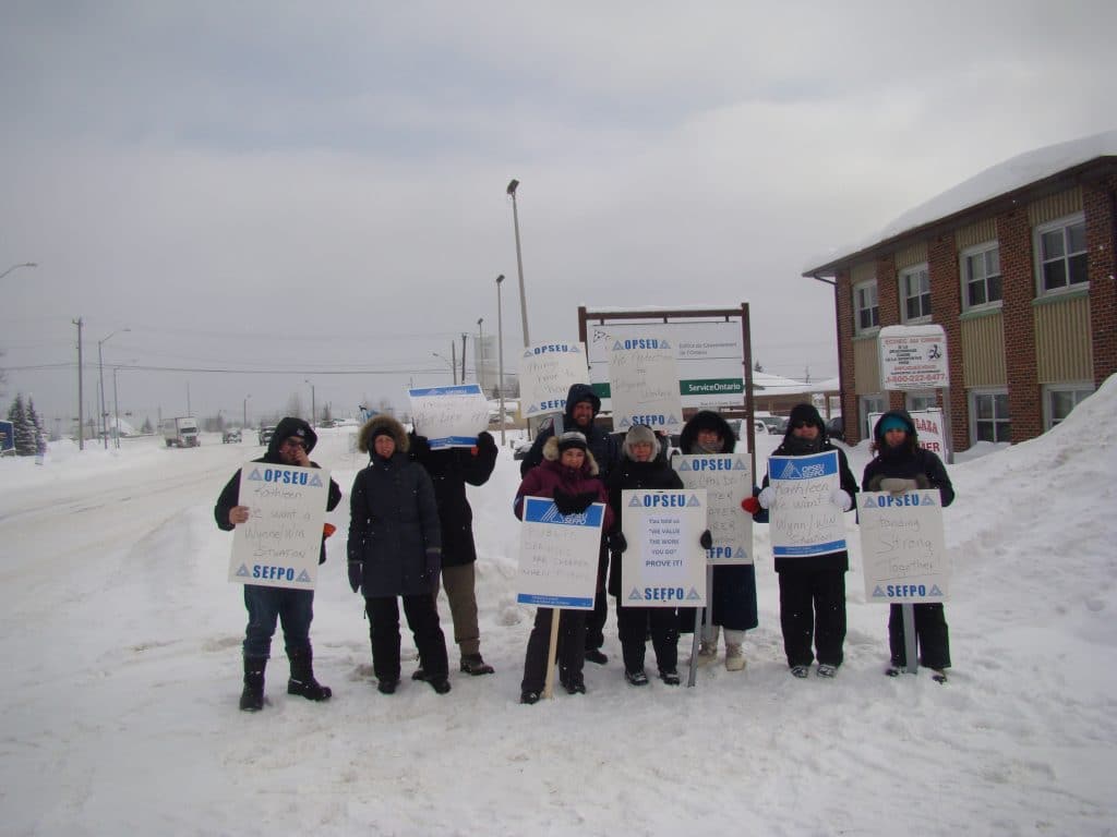 OPSEU members on strike, holding picket signs in Hearst