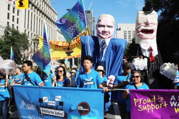 OPSEU members march in the 2018 Labour Day Parade with Doug Ford puppet.