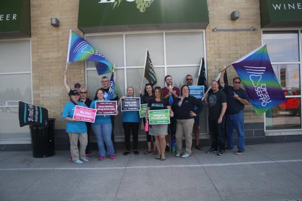 LBED workers standing in front of LCBO store in Napanee for information picket