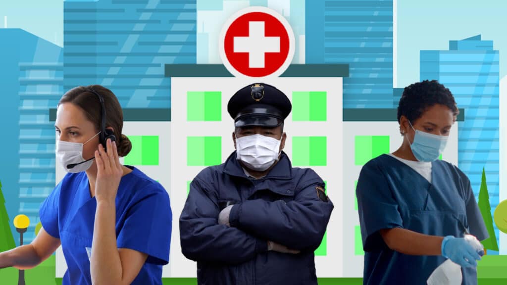 Three health care support workers wearing masks