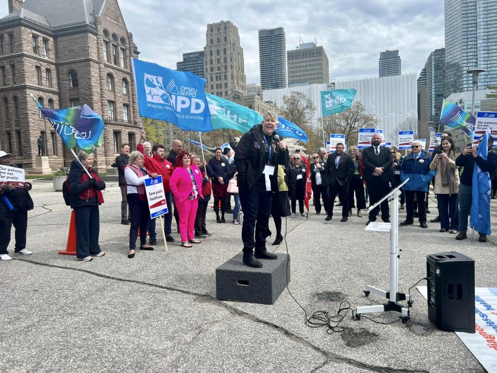 OPSEU/SEFPO picketers outside Queen's Park protesting healthcare privatization being addressed by President JP Hornick
