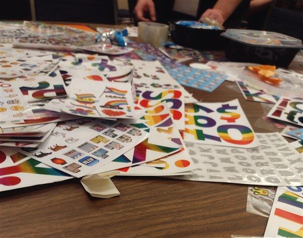 Various colourful sticker sheets spread out on a table top