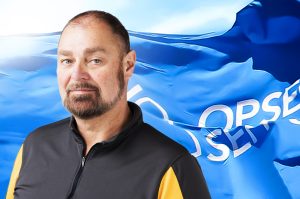 Dan Brisson with an OPSEU/SEFPO flag in the background