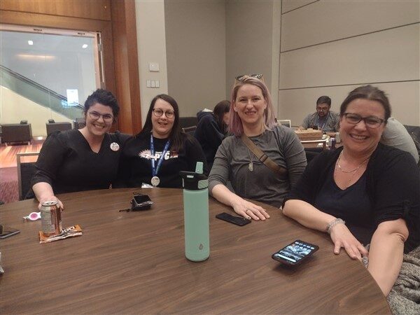 Members sitting at a table at PYC Trivia Night