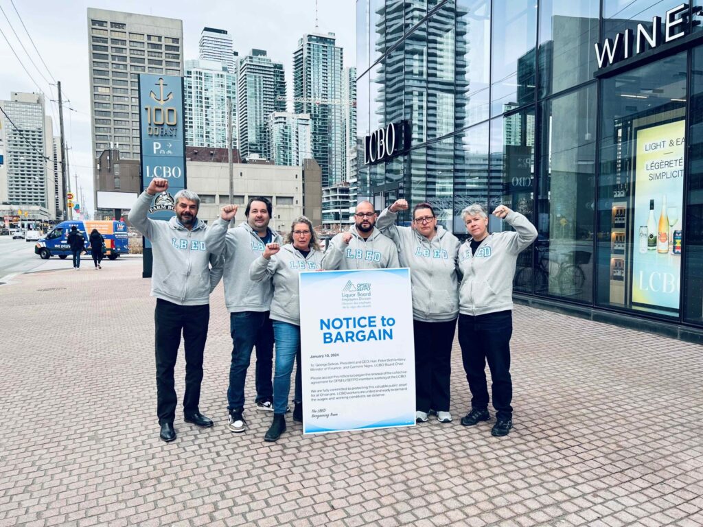 LBED Bargaining Team outside head office with notice to bargain