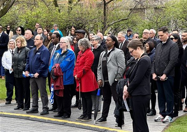 A crowd of people stand outside at the Correctional Services Ceremony of Remembrance 2023