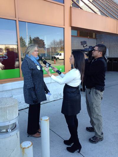 Denise Davis, Chair of the OPSEU Liqour Board Employees Division, speaks with the media
